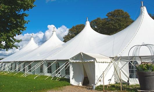 a line of sleek and modern portable restrooms ready for use at an upscale corporate event in Orange, NJ